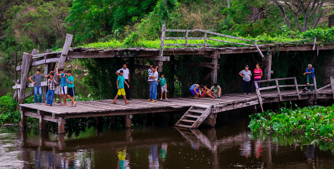 community by river in Paraguay