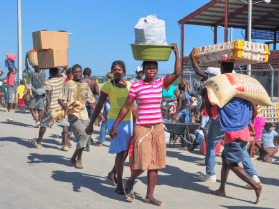 people carrying food in Haiti