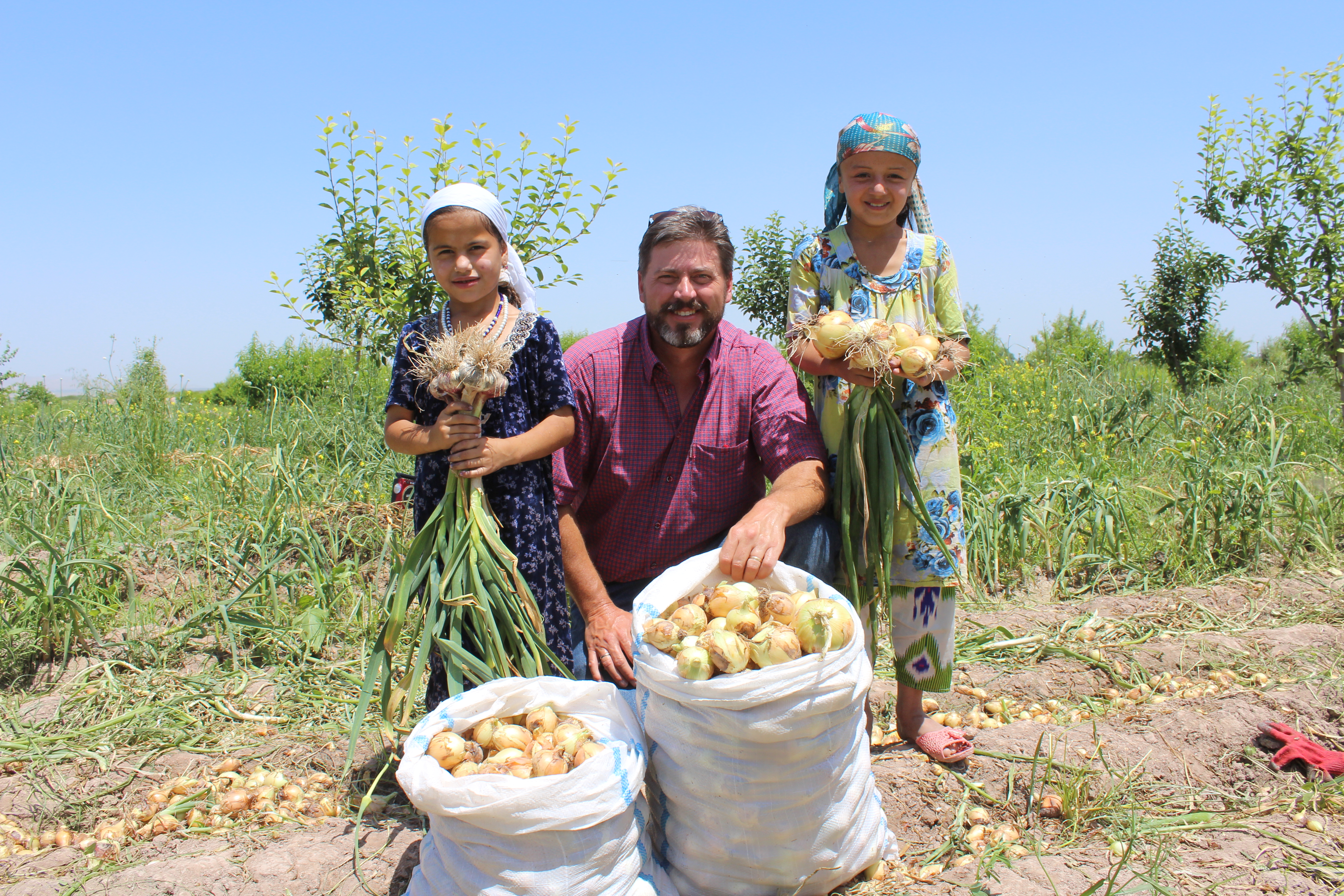 Armenia ECCA farmer with his daughters