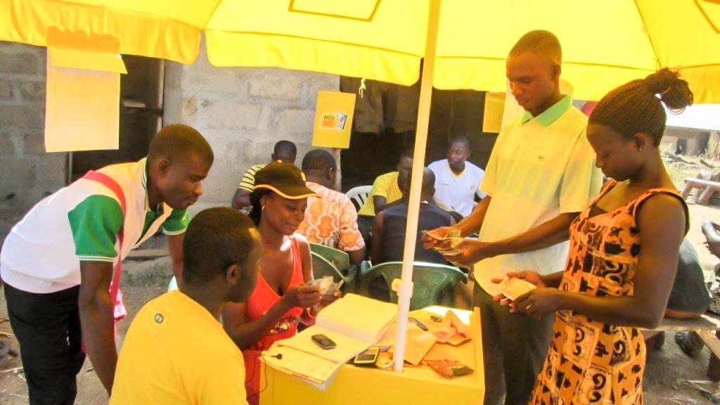 Ghana ADVANCE Beneficiaries of the mobile money service carrying out a transaction