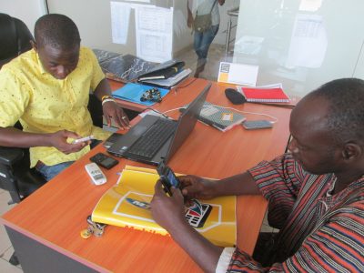 Ghana ADVANCE MTN official registering a project beneficiary as a merchant