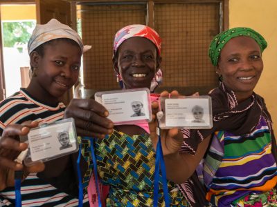 Ghana Advance II women holding smart cards