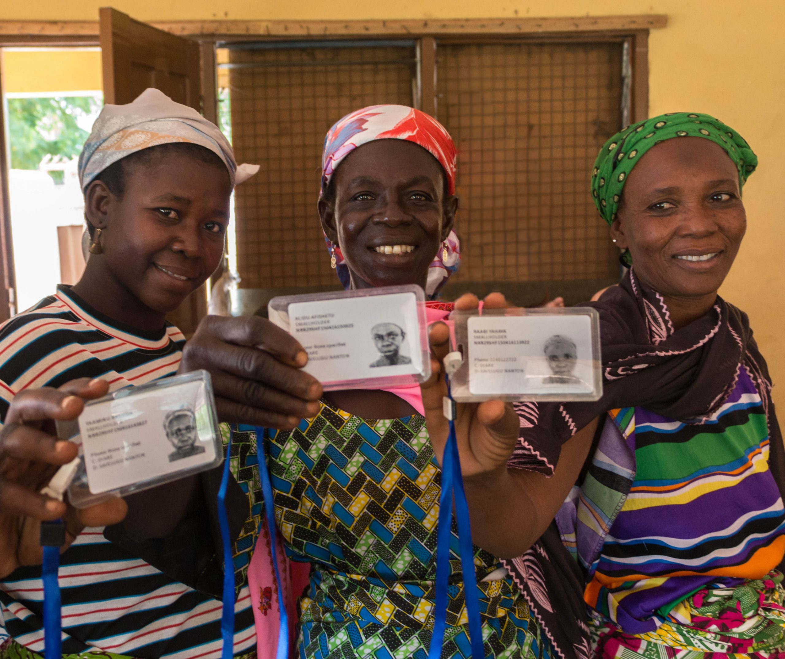 Ghana Advance II women holding smart cards