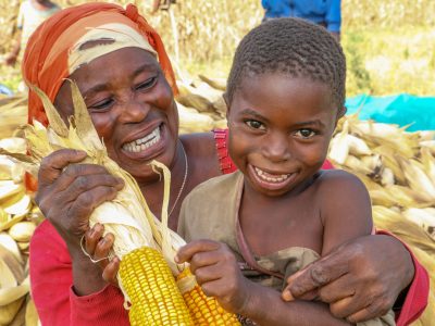 Ghana ADVANCE mother and son at maize harvest
