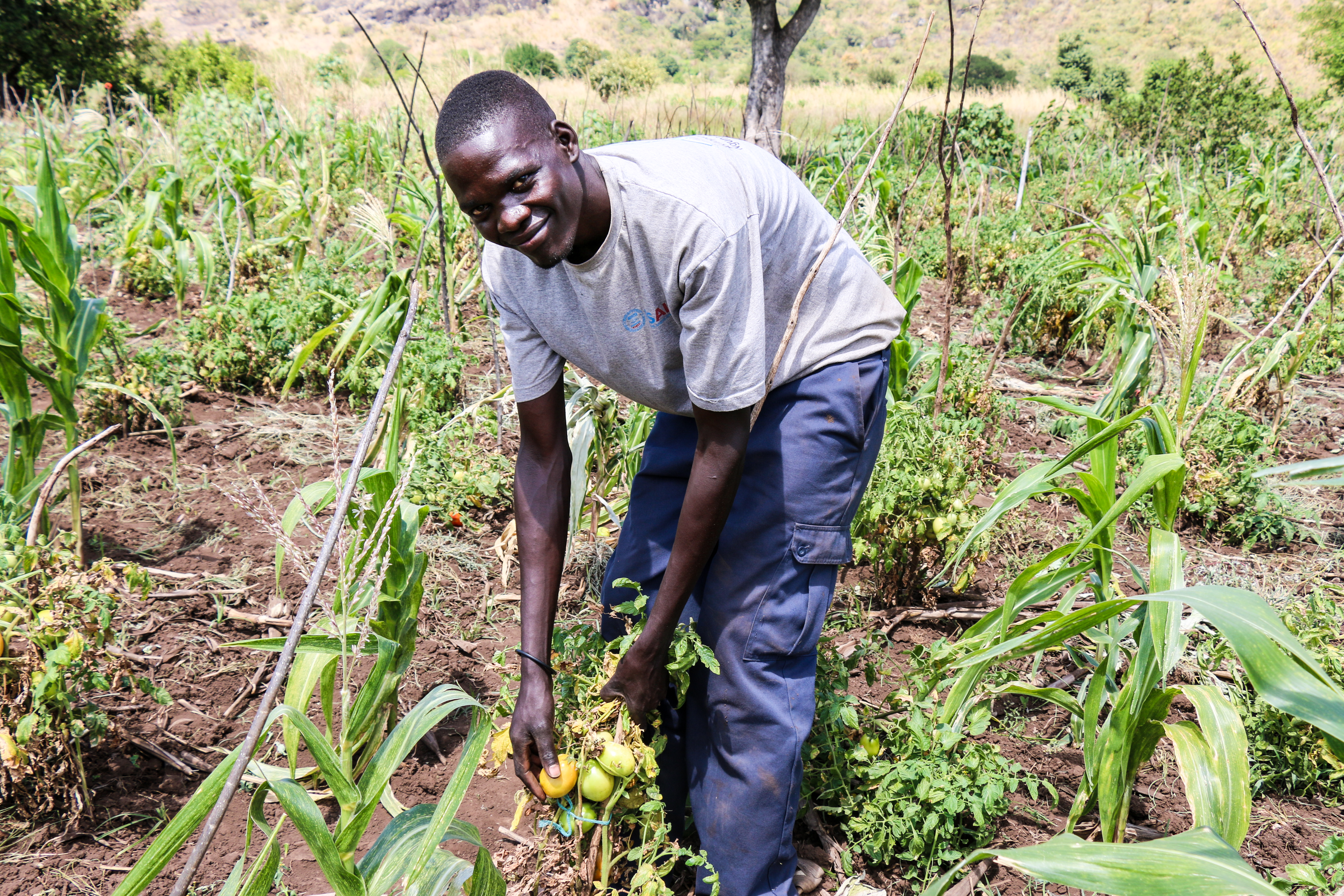 ACDI/VOCA Uganda USAID-funded RWANU youth participant in agricultural field