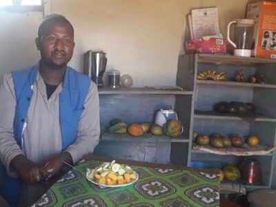 Man with plate of fresh fruit