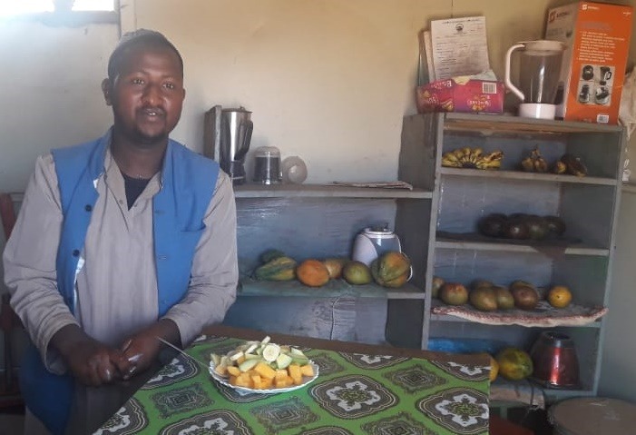 Man with plate of fresh fruit