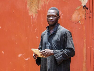 Young man with his goats in Ghana