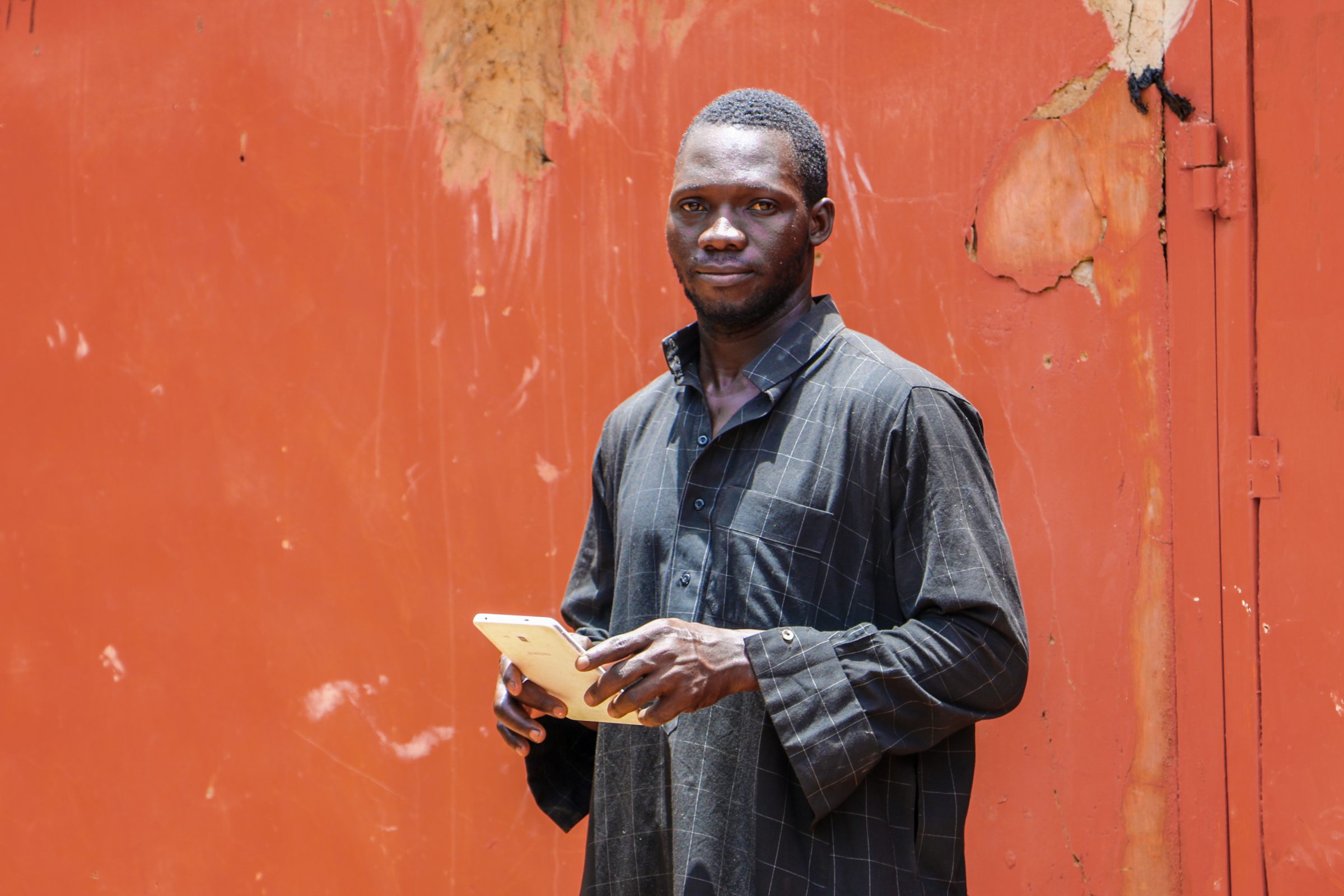 Young man with his goats in Ghana