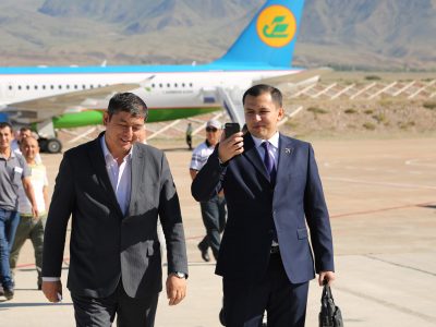 Kyrgyz Republic businessmen on cell phones