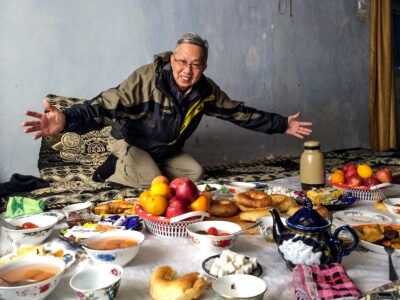 Man displaying bounty of home grown food