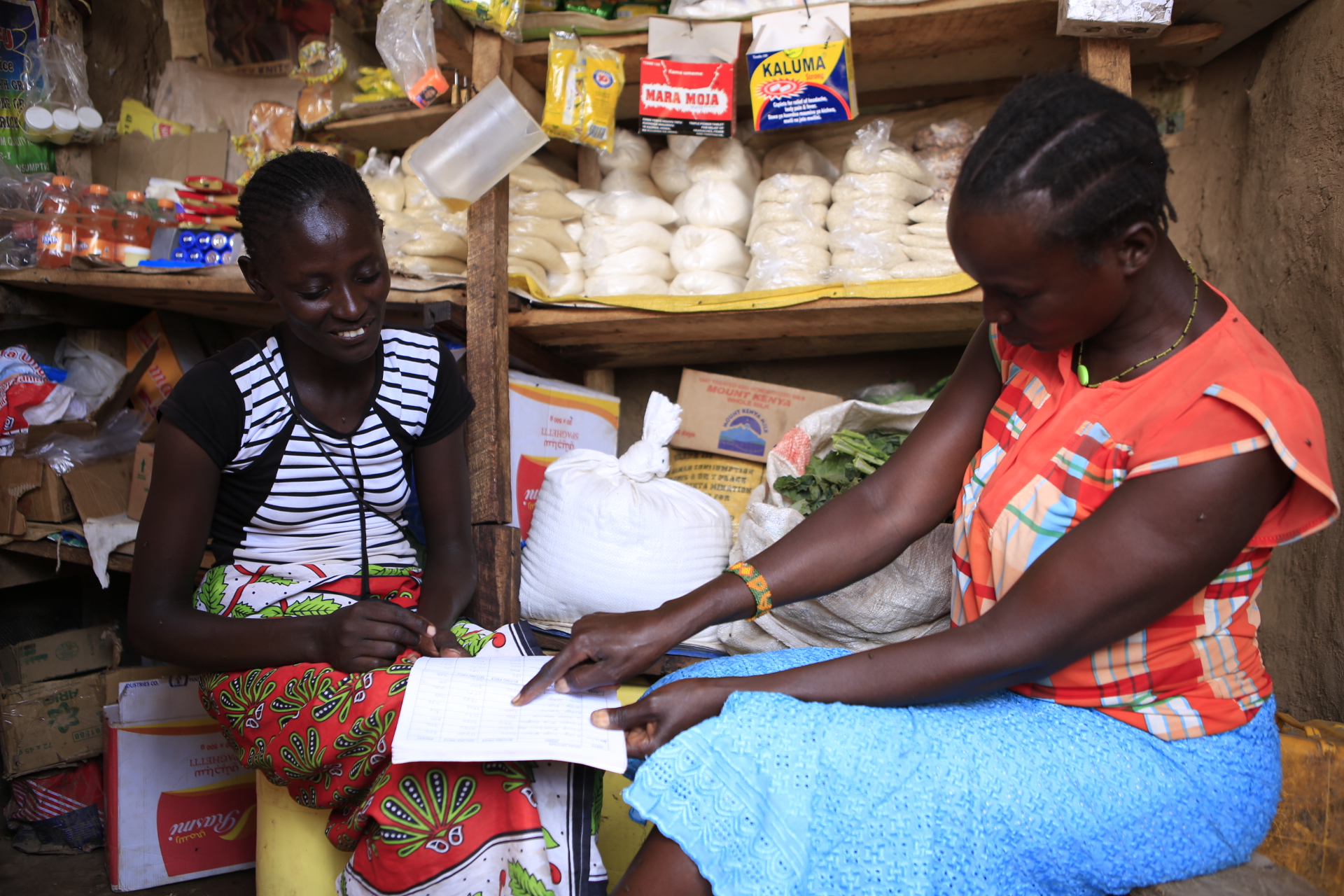 African women talking in marketplace