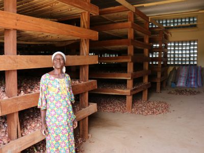 Pascaline-onion-farmer-in-warehouse-Burkina-Faso