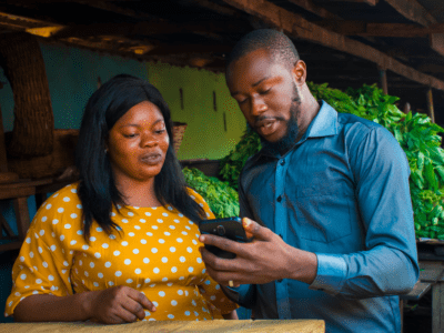 Man and woman talking by new phone