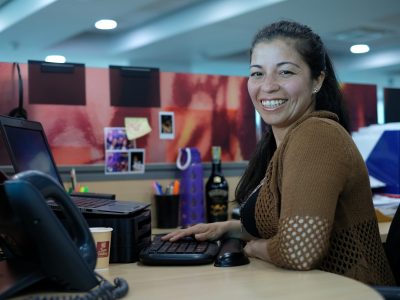 Smiling woman at computer