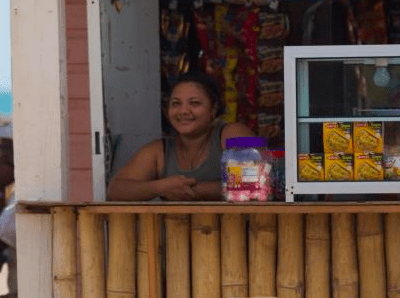 Honduras_TMS_tourism image_woman in stand at beach