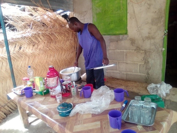 Text Box: “That's how I made my tippy tap and all my customers wash their hands before eating and after eating, they waste less water, some passersby also wash their hands because of the COVID-19 pandemic. The tippy tap is easy to create and people like to use it.” – Ouédraogo Boydouyalma, a restaurant owner in Pissila 

